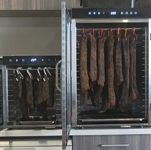 KK11 and KK16 Biltong Boss side by side on a kitchen bench showing the size difference